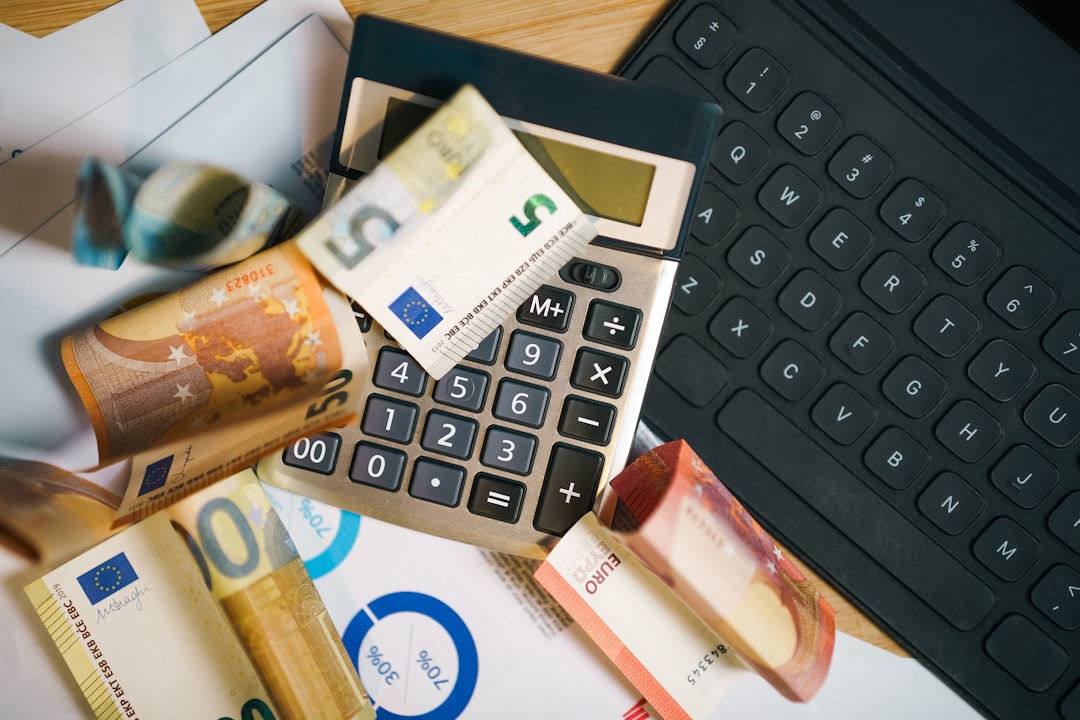 Person using the debt avalanche method to calculate and pay off high-interest debt faster