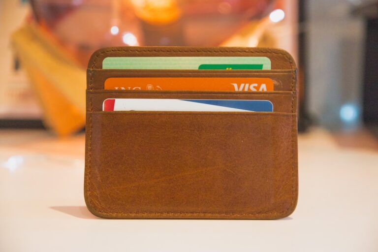 Person holding multiple credit cards, illustrating credit card debt statistics in 2026