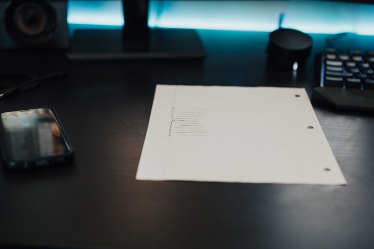 Person reviewing a medical bill at a desk, preparing to negotiate medical bills by phone