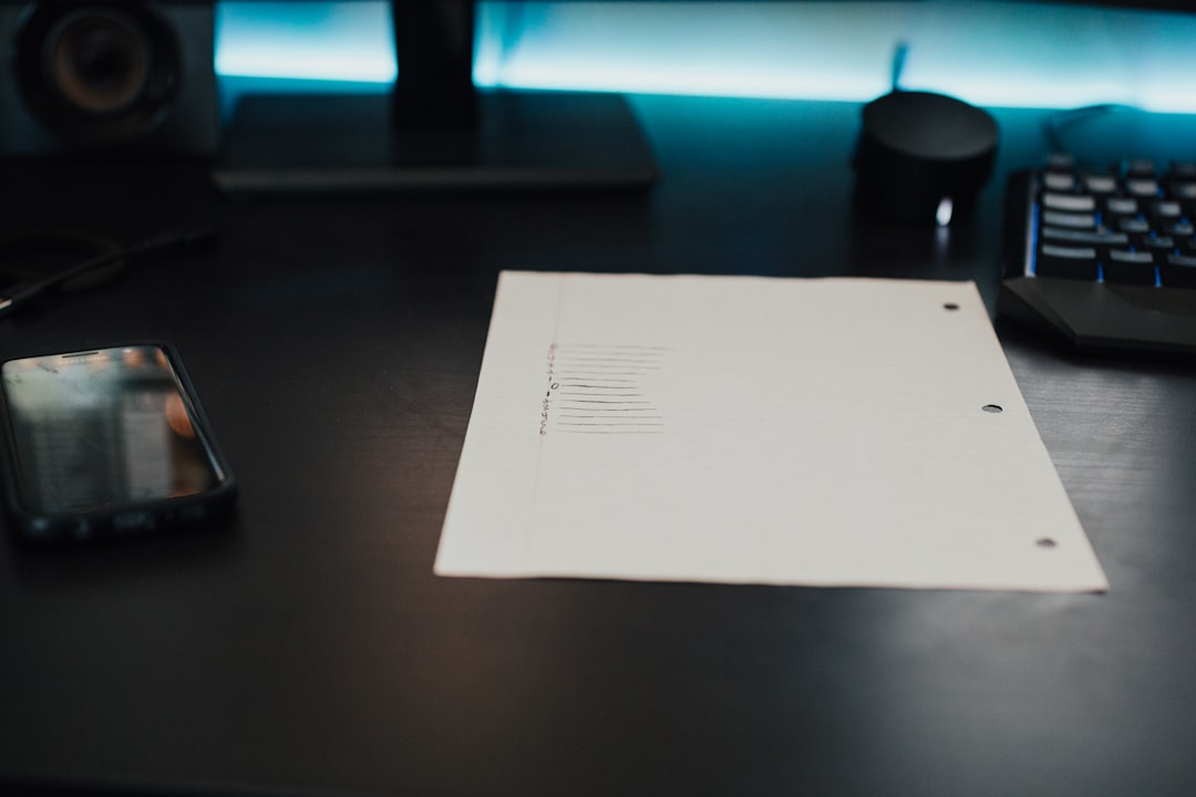 Person reviewing a medical bill at a desk, preparing to negotiate medical bills by phone