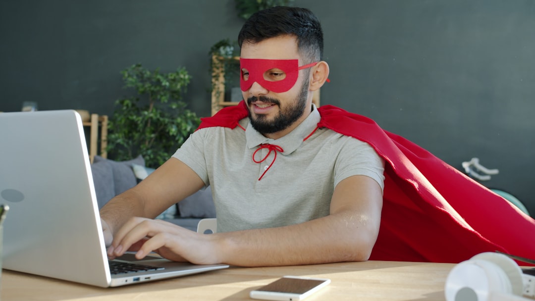 Person working at a home desk with no 401k at work, researching retirement savings options on their own