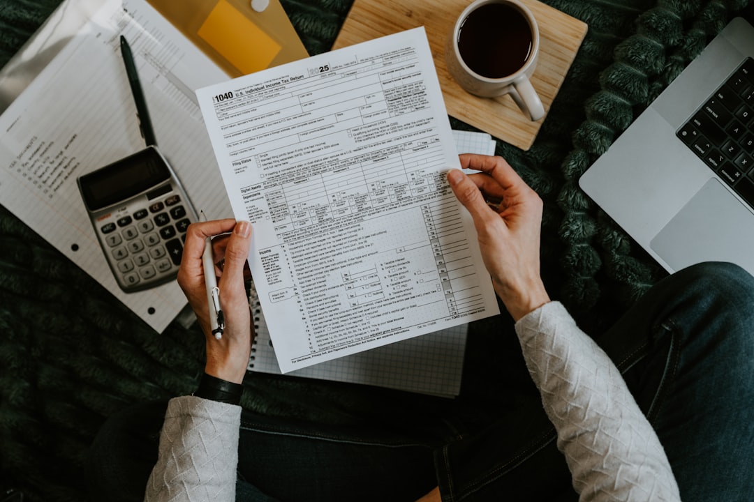 Person reviewing bank statement to compare overdraft protection vs line of credit options