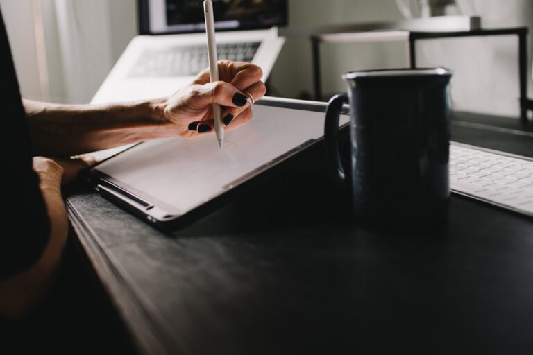 Self-employed person working at home desk comparing SEP IRA vs Solo 401k retirement options