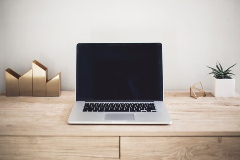 Person working on a laptop at a kitchen table exploring side hustles that actually work in 2026