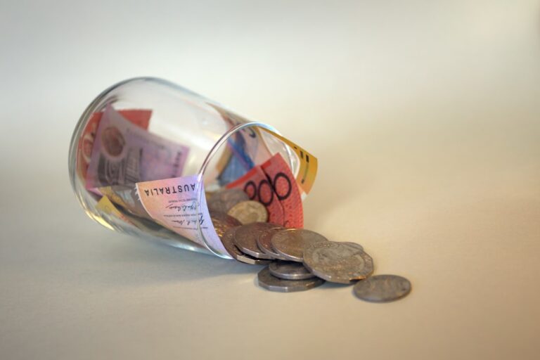 A glass jar labeled "retirement" with coins and dollar bills inside, representing starting a Roth IRA at 35