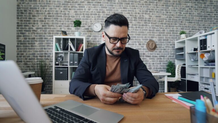 Employee reviewing ESPP tax rules and pay stub at a work desk