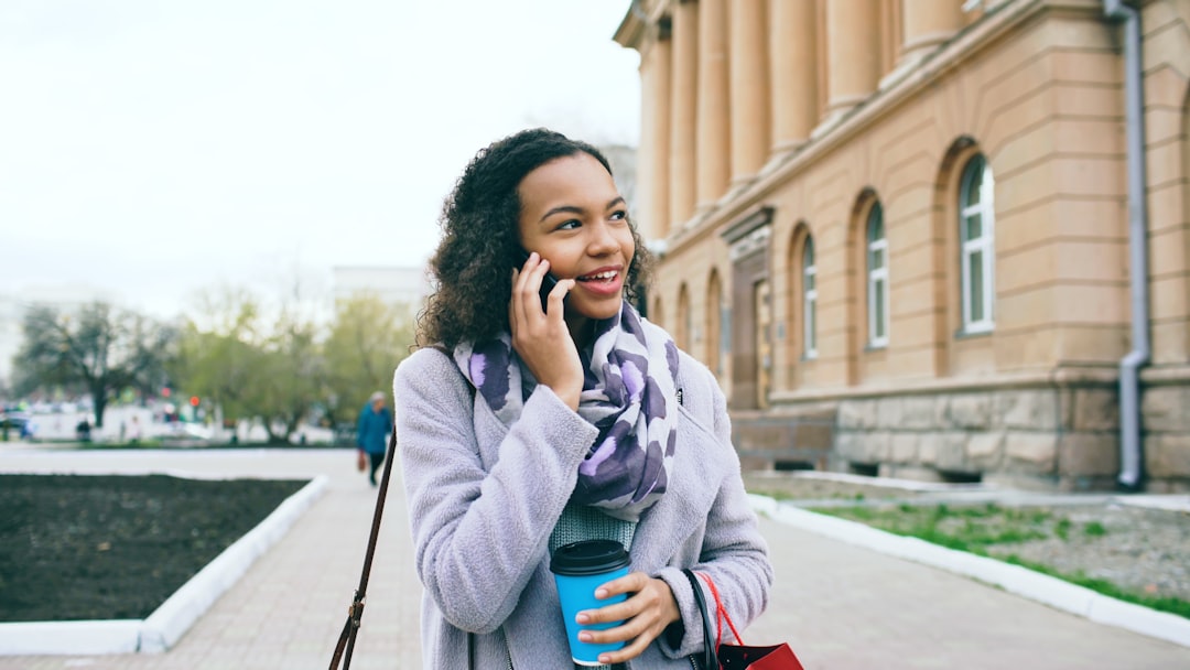Person on phone with bank customer service, ready to negotiate bank fees and get a refund